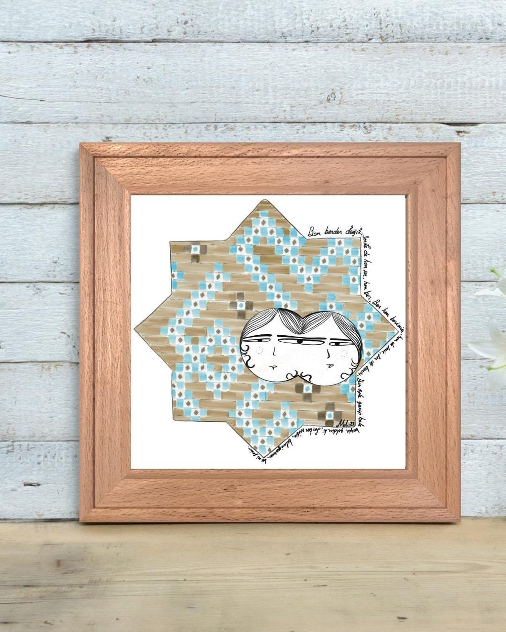 Digital art print of a whimsical double-faced couple illustrated within a Seljuk-style 8-point star pattern, decorated in blue and tan geometric tiles. Framed and displayed in a minimalist modern room.