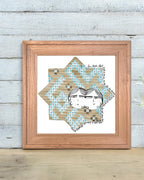 Digital art print of a whimsical double-faced couple illustrated within a Seljuk-style 8-point star pattern, decorated in blue and tan geometric tiles. Framed and displayed in a minimalist modern room.